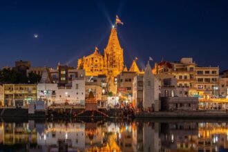 The Dwarkadhish temple - Devbhoomi Dwarka. Twilight view from Gomti river one of the sacred ancient Temple in Hindu Mythology