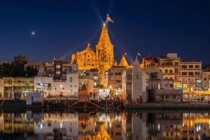 The Dwarkadhish temple - Devbhoomi Dwarka. Twilight view from Gomti river one of the sacred ancient Temple in Hindu Mythology