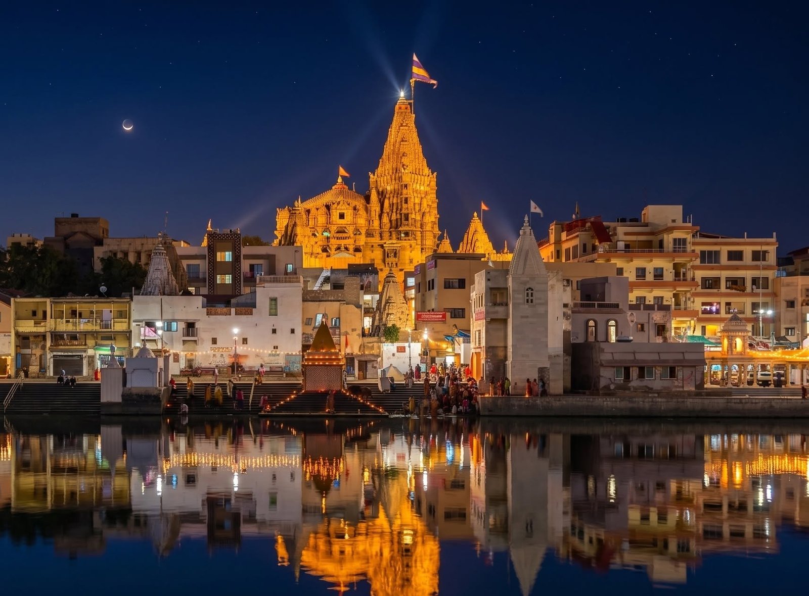 The Dwarkadhish temple - Devbhoomi Dwarka. Twilight view from Gomti river one of the sacred ancient Temple in Hindu Mythology