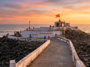 Exterior view of Bhadkeshwar Mahadev Temple in Dwarka from the stone walkway leading to the temple.