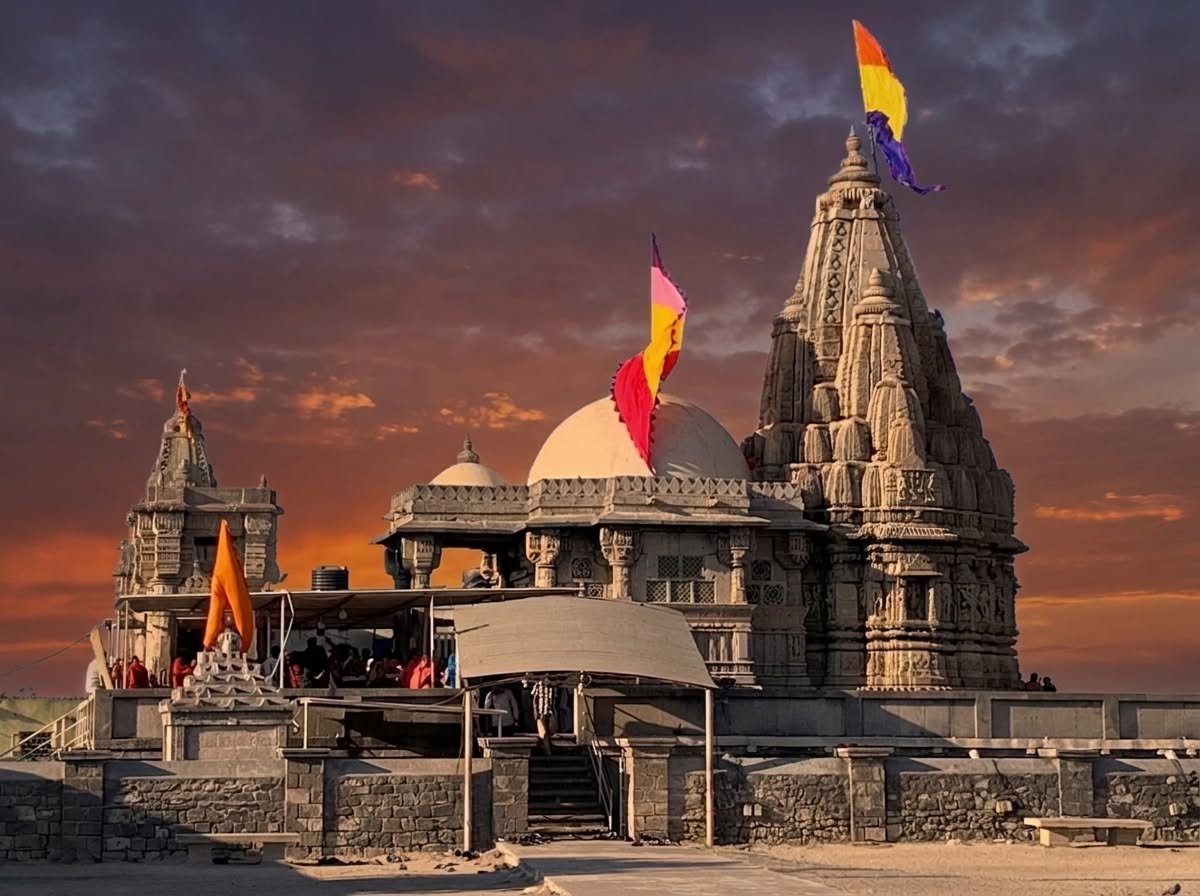 Front view of Rukmini Devi Mandir in Dwarka, Gujarat, showing the sandstone carvings and temple spire.